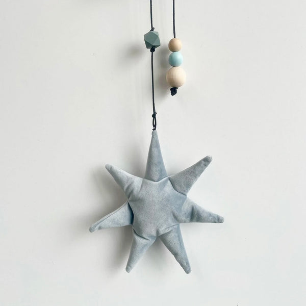 Uro med måne og stjerne i velour.