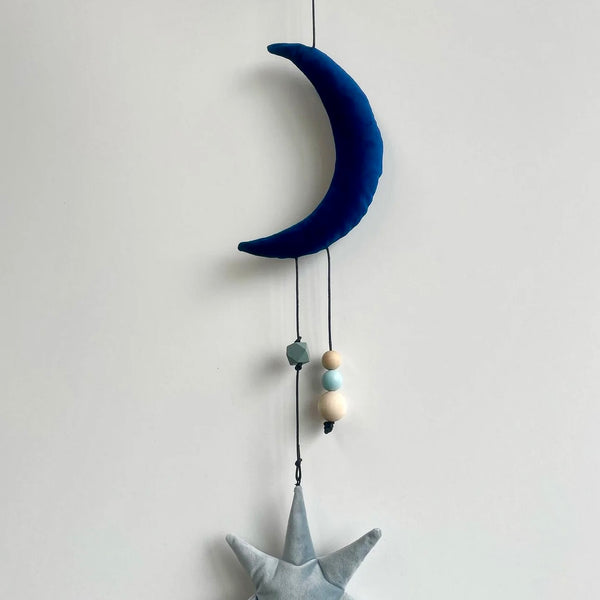 Uro med måne og stjerne i velour.