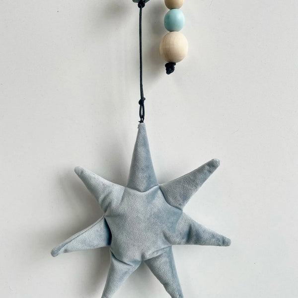 Uro med måne og stjerne i velour.