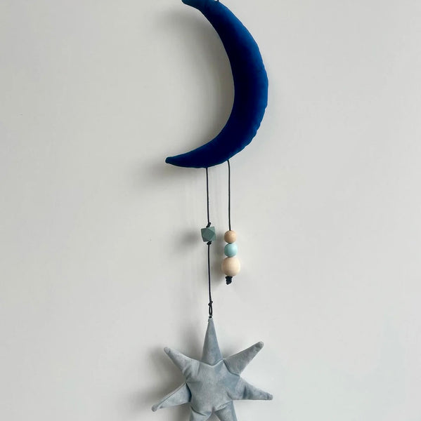 Uro med måne og stjerne i velour.