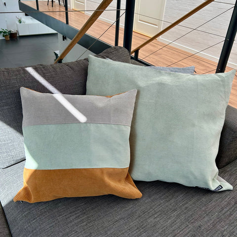 Pudebetræk i mørk kit, lys salvie og gylden brun fløjl. Bagsiden er gyldenbrun.