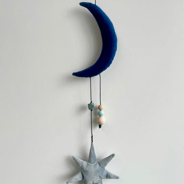 Uro med måne og stjerne i velour.